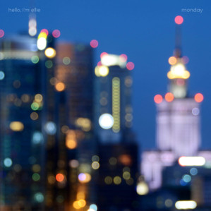 An out-of-focus image of a city at night. 'hello, i'm ellie' is at the top left, and 'monday' is at the top right.